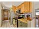 Kitchen features wood cabinets, stainless steel appliances, and butcher block countertops at 2134 S Scranton Way, Aurora, CO 80014