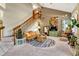 Living room with vaulted ceiling, fireplace, and comfy seating area at 2134 S Scranton Way, Aurora, CO 80014