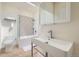 Bright bathroom featuring a modern sink, decorative shower tiles, and a shower/tub combination at 715 W 7Th Ave, Denver, CO 80204