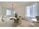 Bright living room featuring a fireplace, hardwood floors, large windows, and neutral decor at 715 W 7Th Ave, Denver, CO 80204