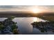 Waterfront properties with stunning lake views, lush landscaping and mountain backdrop at 9833 Shoreline Dr, Longmont, CO 80504