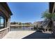 Beautiful backyard showcasing a patio with lake views, stone detailing, and boat house at 9833 Shoreline Dr, Longmont, CO 80504