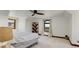 Comfortable bedroom with a ceiling fan and large window offering natural light at 9833 Shoreline Dr, Longmont, CO 80504