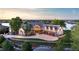 Grand estate showcasing a manicured lawn, waterfront access, and multi-car garage at 9833 Shoreline Dr, Longmont, CO 80504