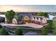 Stunning waterfront home features a large circular driveway, mature landscaping, and a four-car garage at 9833 Shoreline Dr, Longmont, CO 80504