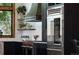 Elegant kitchen featuring high-end appliances, custom cabinetry, and a large window at 9833 Shoreline Dr, Longmont, CO 80504