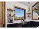 Gourmet kitchen sink area with stainless steel faucet and view of the exterior at 9833 Shoreline Dr, Longmont, CO 80504