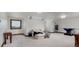Bright and open living room with a couch, large window, and games at 9833 Shoreline Dr, Longmont, CO 80504