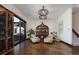 Bright living room with hardwood floors, decorative shelving, stylish lighting, and a sliding glass door at 9833 Shoreline Dr, Longmont, CO 80504