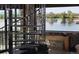 Ornate spiral staircase alongside a lake view with table at 9833 Shoreline Dr, Longmont, CO 80504