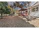 Partial view of house and backyard with pergola and deck at 5123 Red Oak Way, Parker, CO 80134