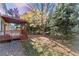 Landscaped backyard with mature trees and shed at 5123 Red Oak Way, Parker, CO 80134