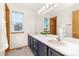 Bathroom with double vanity and window at 5123 Red Oak Way, Parker, CO 80134