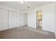 Bright bedroom with double doors leading to a full bathroom at 8678 Decatur St # 288, Westminster, CO 80031