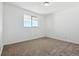 Well-lit bedroom featuring neutral walls and carpet flooring at 8678 Decatur St # 288, Westminster, CO 80031