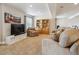 Finished basement with a cozy seating area, built-in shelving, and ample space for relaxation and entertainment at 3309 Springbriar Dr, Castle Rock, CO 80109