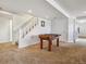 Spacious finished basement with carpet and stairway and a foosball table and is ready for entertaining guests at 3309 Springbriar Dr, Castle Rock, CO 80109