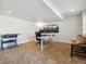 Finished basement featuring a modern desk setup, ample lighting, and versatile space for a home office or study at 3309 Springbriar Dr, Castle Rock, CO 80109