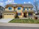 Two-story home with a large front yard, covered porch, and a two-car garage at 3309 Springbriar Dr, Castle Rock, CO 80109