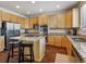 The charming kitchen is equipped with stainless appliances, granite counters, and a convenient center island at 3309 Springbriar Dr, Castle Rock, CO 80109