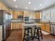Modern kitchen with stainless steel appliances, center island with granite countertops, and tile floors at 3309 Springbriar Dr, Castle Rock, CO 80109