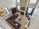 Overhead view of the living room features soaring ceilings, a fireplace and a large sectional sofa at 3309 Springbriar Dr, Castle Rock, CO 80109