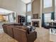 Spacious living room features a fireplace, plush carpet, and lots of natural light at 3309 Springbriar Dr, Castle Rock, CO 80109