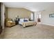 Spacious main bedroom with carpet, a sitting area, and an ensuite bathroom at 3309 Springbriar Dr, Castle Rock, CO 80109