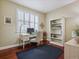 Bright office with a desk, chair, and bookshelf with lots of natural light at 3309 Springbriar Dr, Castle Rock, CO 80109