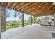 Covered patio featuring brick supports, green grass, and a hot tub at 3462 W 109Th Cir, Westminster, CO 80031