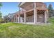 Backyard with patio beneath raised deck and lovely green space at 3462 W 109Th Cir, Westminster, CO 80031
