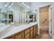 Bathroom with a large mirror, vanity, and a separate door to the toilet and bath at 3462 W 109Th Cir, Westminster, CO 80031