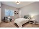 Cozy bedroom featuring a comfortable bed, chair, and soft natural light at 3462 W 109Th Cir, Westminster, CO 80031