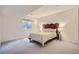 Cozy bedroom features neutral decor, a decorative headboard and natural lighting from the window at 3462 W 109Th Cir, Westminster, CO 80031