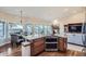Open kitchen with granite countertops, stainless appliances, and views to the living area at 3462 W 109Th Cir, Westminster, CO 80031