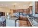 Open-concept kitchen with granite countertops, stainless steel appliances, and ample storage at 3462 W 109Th Cir, Westminster, CO 80031
