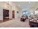 Bright living room featuring high ceilings, large windows, and a view into the library at 3462 W 109Th Cir, Westminster, CO 80031
