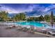 Large community pool with lounge chairs and umbrellas for residents at 3462 W 109Th Cir, Westminster, CO 80031