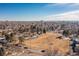 Wide aerial shot showing the large park and surrounding neighborhood on a clear day at 3130 S Washington St, Englewood, CO 80113