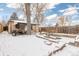 Backyard with dining set, wooden fence and firepit at 3130 S Washington St, Englewood, CO 80113