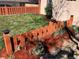 Charming front yard featuring a well-maintained lawn and a decorative wooden fence at 3130 S Washington St, Englewood, CO 80113