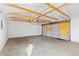 Garage interior featuring white walls and a concrete floor at 3130 S Washington St, Englewood, CO 80113