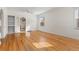 Bright living room with hardwood floors, built-in shelving, and arched doorways at 3130 S Washington St, Englewood, CO 80113