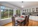 Bright dining area with hardwood floors and view of backyard at 4700 Waldenwood Dr, Highlands Ranch, CO 80130