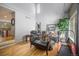 Bright living room with hardwood floors, high ceilings, and comfortable seating at 4700 Waldenwood Dr, Highlands Ranch, CO 80130