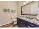 Well-lit bathroom features a vanity with granite countertop, modern fixtures, and stylish décor at 3477 New Haven Cir, Castle Rock, CO 80109