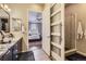 Ensuite bathroom with modern shower, double vanity with granite countertop, and access to the bedroom at 3477 New Haven Cir, Castle Rock, CO 80109