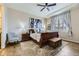 Comfortable bedroom with a wooden sleigh bed, stylish decor, and natural light at 3477 New Haven Cir, Castle Rock, CO 80109