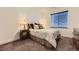 Cozy bedroom featuring neutral walls, carpet, and natural light from the window at 3477 New Haven Cir, Castle Rock, CO 80109