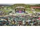 Outdoor concert venue with a large stage and a crowd of attendees enjoying the event at 3477 New Haven Cir, Castle Rock, CO 80109